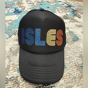 Unsweetened New York black trucker cap with colorful glitter ISLES Logo